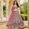Pink gold embroidered lehenga set with intricate handwork, worn with matching blouse and dupatta for wedding and festive occasions