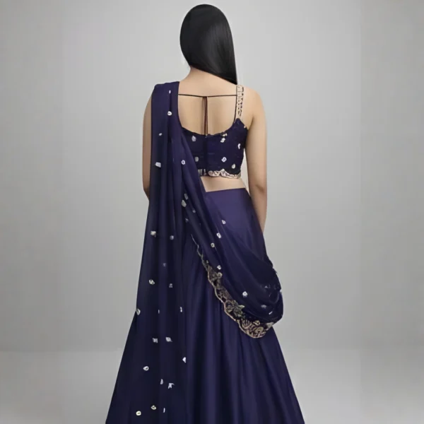 Back view of navy blue lehenga saree with embroidered blouse and elegant draped pallu