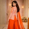 Back view of rust sharara set with zardosi embroidery and flowing dupatta