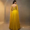 Back view of yellow Indo western lehenga with handworked blouse and flowing dupatta