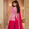 Back profile of hot pink hand embroidered lehenga with golden zari jacket for festive occasions